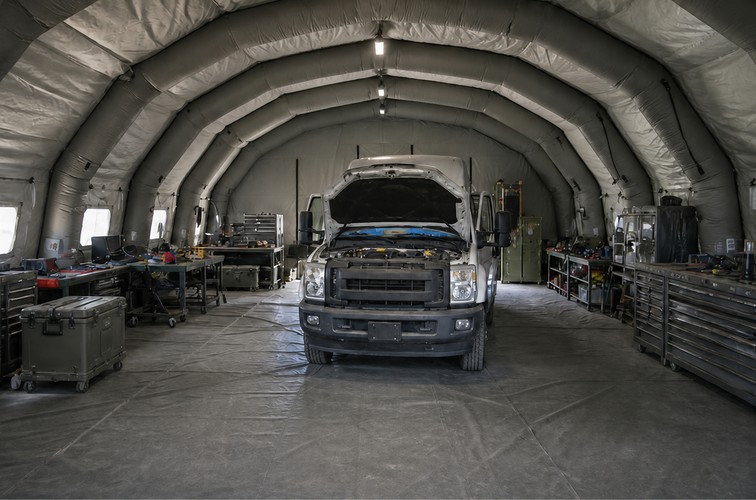 Illustrative large-span inflatable maintenance shelter around a utility vehicle